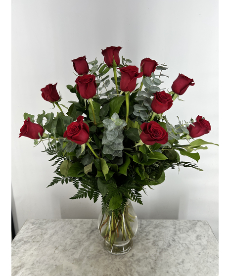 One dozen roses in your choice of color, with glass vase included. 